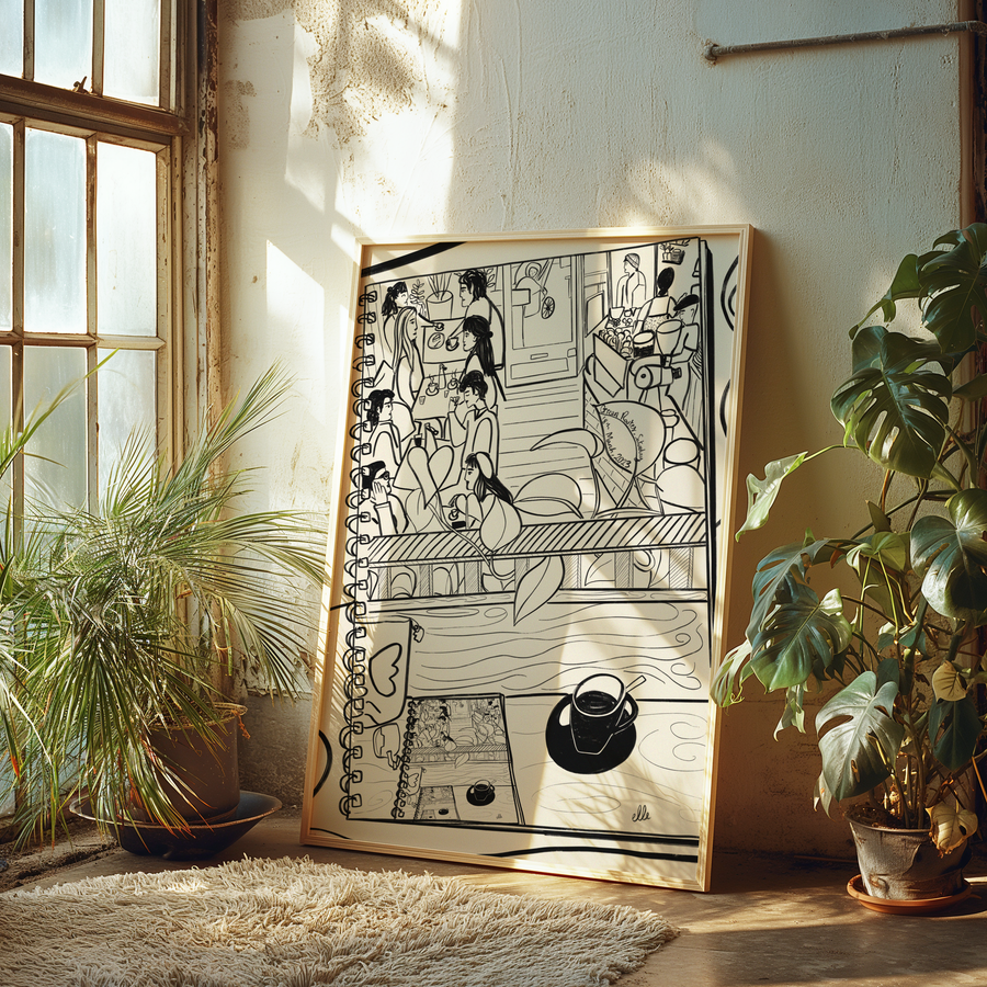 Framed black and white artwork on a wall with plants and a window in the background